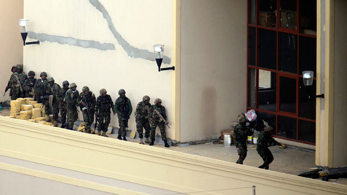 Kenya Defence Forces soldiers comb the rooftop of the Westgate shopping mall in Nairobi September 24, 2013.(Reuters / Noor Khamis)