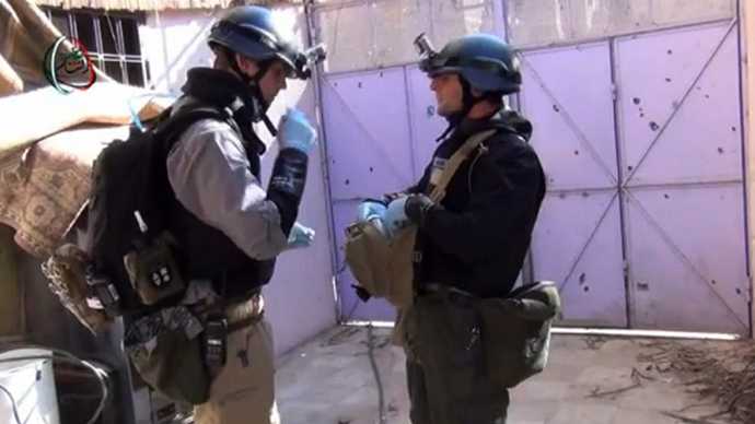 A United Nations (UN) arms experts inspecting the site where rockets had fallen in Damascus' Moadamiyet al-Sham suburb as they investigate an alleged chemical weapons strike near the capital. (AFP Photo / Moadamiyet al-Sham media centre)