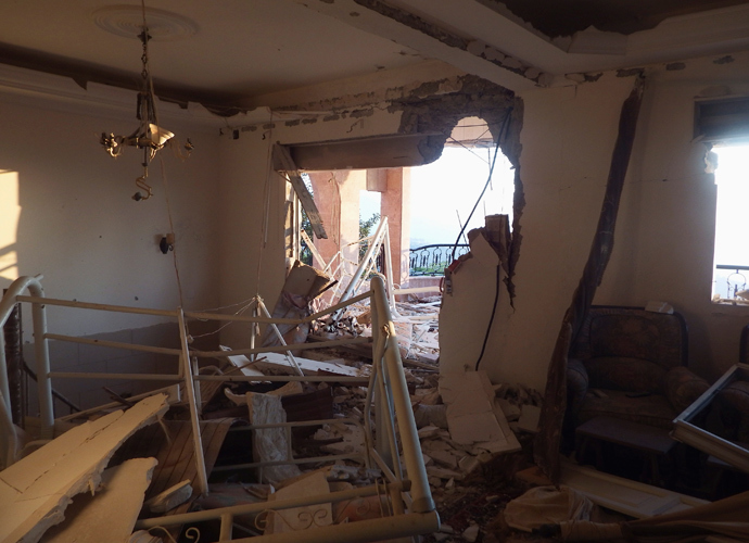 A view inside a damaged house after what activists said was an air raid by forces loyal to Syria's President Bashar al-Assad in Salma town, Latakia governorate August 16, 2013 (Reuters / Khattab Abdulaa)