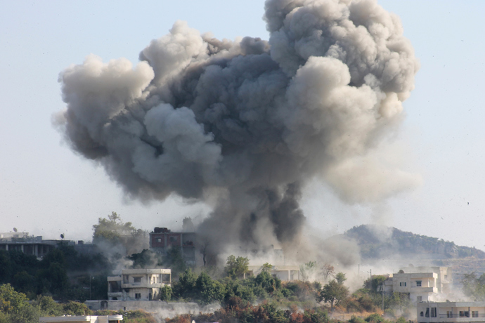 Smoke rises after what activists said was shelling by forces loyal to Syria's President Bashar al-Assad in the village of Dourit, in Latakia countryside August 17, 2013 (Reuters / Khattab Abdulaa)