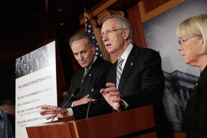 Senate Majority Leader Sen. Harry Reid (D-NV) speaks to the media as U.S. Sen. Charles Schumer (D-NY) (L) and Sen. Patty Murray (D-WA) (R) look on, after the Senate reached a deal to end the government shutdown at the U.S. Capitol October 16, 2013 in Washington, DC (AFP Photo / Win McNamee)