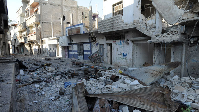 Debris and damaged buildings in the town of Hujeira south of the Syrian capital Damascus.(AFP Photo / STR)