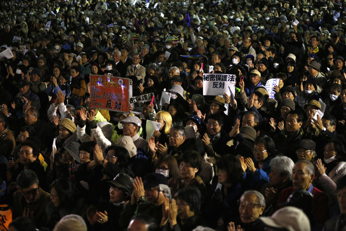 Protesters hold placards reading "Stop Secrecy Act" during a rally against the government's planned secrecy law in Tokyo November 21, 2013. (Reuters/Issei Kato)