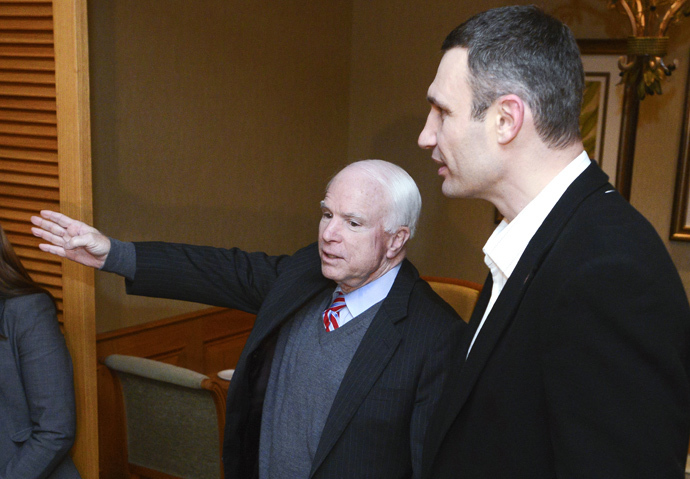 US Senator John McCain (L) gestures as he speaks to Head of UDAR (Punch) party Vitali Klitschko during a meeting with leaders of Ukrainian opposition in Kiev on December 14, 2013. McCain arrived to Ukraine over the weekend, a trip that will make him the highest-ranking US official to visit the former Soviet republic since protests erupted there last month over Kievâs move to tighten ties with Moscow. (AFP Photo / Batkivshchyna Party Press-Service Pool / Andrew Kravchenko)
