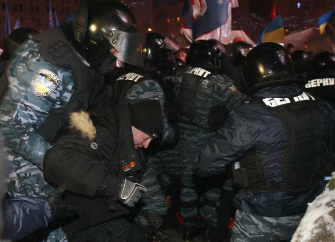 Riot police officers detain a protester in Kiev December 11, 2013. (Reuters/Gleb Garanich)