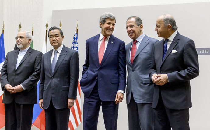 A file photo taken on November 24, 2013 shows (from L) Iranian Foreign Minister Mohammad Javad Zarif, Chinese Foreign Minister Wang Yi, US Secretary of State John Kerry, Russian Foreign Minister Sergei Lavrov and French Foreign Minister Laurent Fabius reacting during the reading of a statement in Geneva regarding a landmark deal with Iran to halt parts of its nuclear programme (AFP Photo / Fabrice Coffrini)