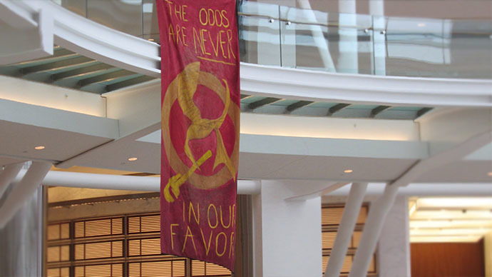 Environmental activists face up to ten years in prison for glitter-covered banner