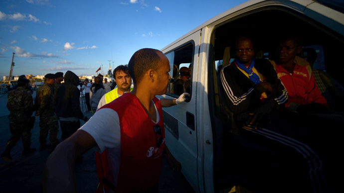 ‘Like concentration camp’: Strip-spraying migrants video shocks Italy