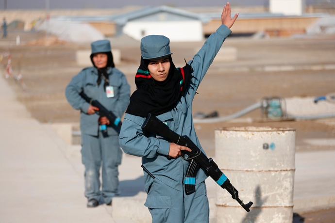 A female Afghan National Police (ANP) officer gives instructions during a patrol training session, at a training centre near the German Bundeswehr army camp in Kunduz, northern Afghanistan December 3, 2012. (Reuters / Fabrizio Bensch)