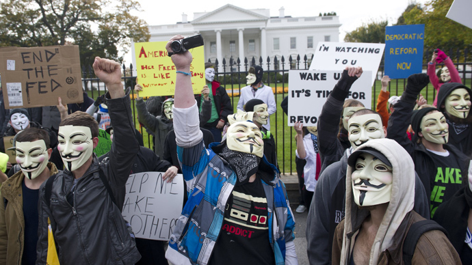 Demonstrators, including supporters of the group Anonymous, march in a protest against corrupt governments and corporations in front of the White House in Washington, DC, November 5, 2013 (AFP Photo / Saul Loeb)