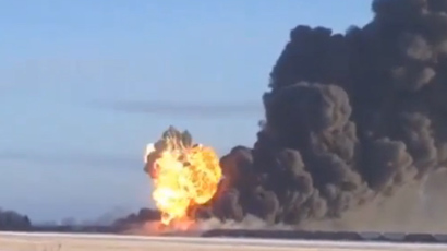 Penn. train derailment leaks thousands of gallons of oil, sends car into building