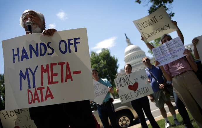 Kwazi Nkrumah speaks while joining protesters rallying outside the U.S. Capitol against the NSA's recently detailed surveillance programs June 13, 2013 in Washington, DC. (AFP Photo / Win Mcnamee)