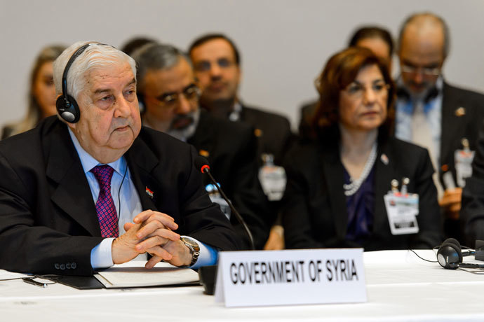 Syrian Foreign Minister Walid Muallem (L) and his delegation take part in the so-called Geneva II peace talks on January 22, 2014 in Montreux.(AFP Photo / Fabrice Coffrini)