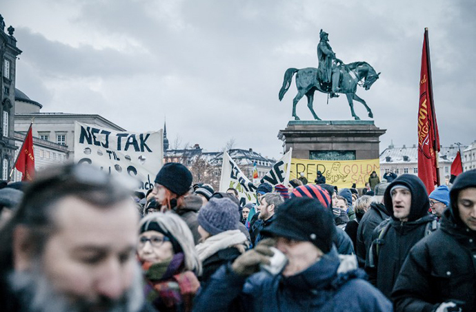 People demonstrate against US multinational investment banking firm Goldman Sachs buying into the National Danish electricity supplier DONG in front of the Danish Parliament on January 29, 2014. (AFP Photo / Jeppe Bjoern Vejloe)