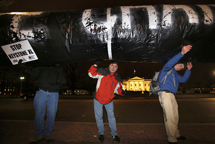 Protesters hold a giant inflated tube during a rally against the Keystone XL oil pipeline outside The White House in Washington February 3, 2014. (Reuters / Yuri Gripas)