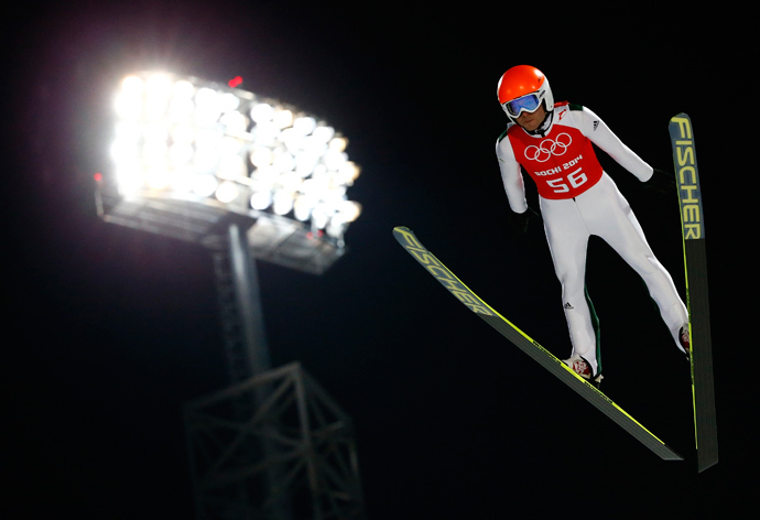 Slovenia's Jernej Damjan soars through the air during the men's ski jumping individual normal hill training event of the Sochi 2014 Winter Olympic Games, at the RusSki Gorki Ski Jumping Center in Rosa Khutor, February 6, 2014. (Reuters / Michael Dalder)