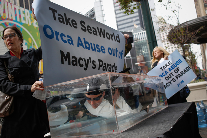 PETA activists demonstrate outside the Macy's Herald Square store protesting the plan for SeaWorld to have a float at the Macy's Thanksgiving Day Parade in New York October 23, 2013. (Reuters / Shannon Stapleton)