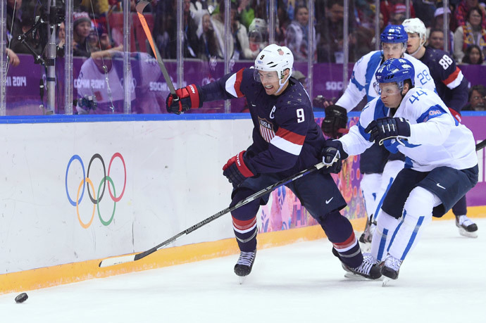 US Zach Parise (L) vies with Finland's Kimmo Timonen during the Men's ice hockey Bronze Medal Game USA vs Finland at the Bolshoy Ice Dome (AFP Photo / Andrej Isakovic)
