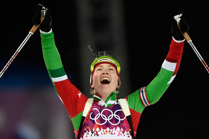 Belarus' Darya Domracheva celebrates as she wins gold in the Women's Biathlon 12,5 km Mass Start at the Laura Cross-Country Ski and Biathlon Center during the Sochi Winter Olympics on February 17, 2014, in Rosa Kuthor, near Sochi. (AFP Photo / Odd Andersen)