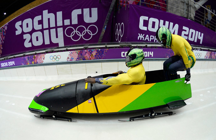 Jamaica-1 two-man bobsleigh steered by Winston Watts races in the Bobsleigh Two-man Heat 1 at the Sanki Sliding Center in Rosa Khutor during the Sochi Winter Olympics on February 16, 2014. (AFP Photo / Lionel Bonaventure)