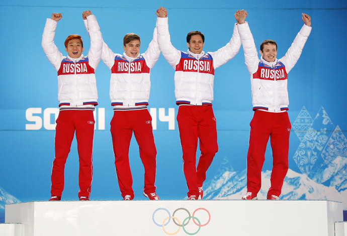 Gold medallists Russia's Victor An, Semen Elistratov, Vladimir Grigorev and Ruslan Zakharov celebrate during the victory ceremony for the men's 5,000 metres relay short track speed skating event at the 2014 Sochi Winter Olympics in Sochi, February 22, 2104. (Reuters / Eric Gaillard)