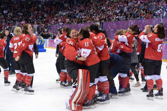 Canada's players celebrate after winning the Women's Ice Hockey Gold Medal Game between Canada and USA at the Bolshoy Ice Dome during the Sochi Winter Olympics on February 20, 2014. (AFP Photo / Jung Yeon-Je)