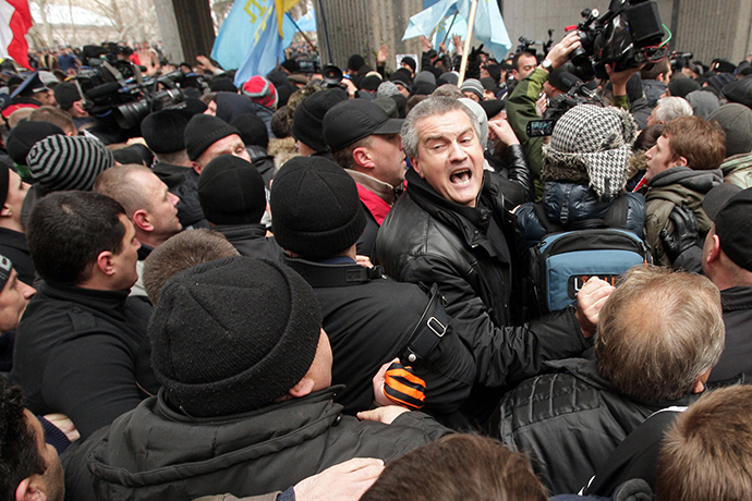 Sergey Aksyonov, center, leader of the Russian Unity public organization and deputy of the Verkhovna Rada of the Crimea, during a rally in front of the Crimea's Supreme Council building in Simferopol (RIA Novosti / Taras Litvinenko)