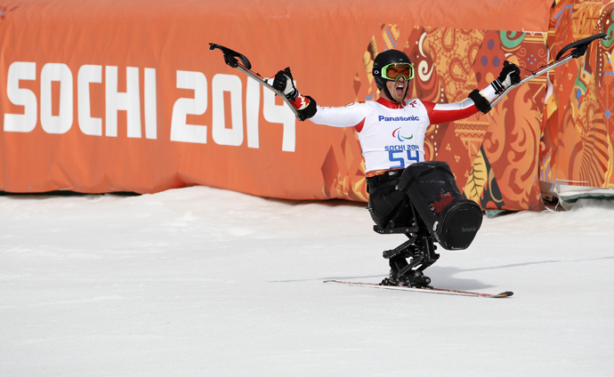 Canada's Josh Dueck reacts in the finish area during the men's sitting skiing downhill at the 2014 Sochi Paralympic Winter Games at the Rosa Khutor Alpine Center, March 8, 2014 (Reuters / Alexander Demianchuk)