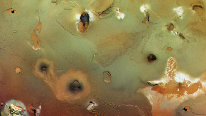 Collapsed volcanoes form large, dark spots on Ioâs surface (Image courtesy of NASA/JPL/University of Arizona)