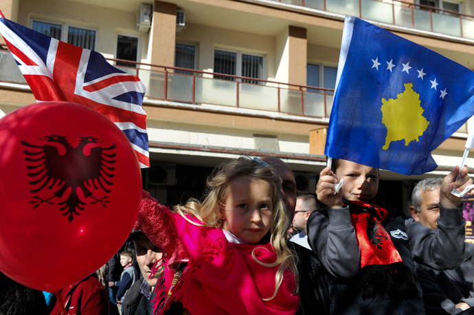 Kosovo children wave Kosovo and British flags during celebrations marking the 6th anniversary of Kosovo's declaration of independence from Serbia, in Pristina on February 17, 2014. (AFP Photo / Armend Nimani)