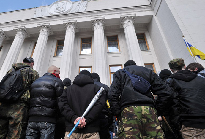 Supporters of the right wing party Pravyi Sector (Right Sector) protest in front of the Ukrainian Parliament in Kiev on March 28, 2014. (AFP Photo / Genya Savilov)
