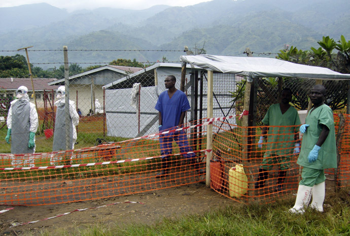 Health workers, some of whom have been disinfected, stand at the entrance of the isolation ward for Ebola suspected patients at Bundibugyo hospital in Uganda December 11, 2007 (Reuters)