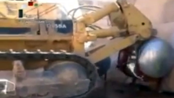 Mechanical digger from the Organisation for the Prohibition of Chemical Weapons (OPCW) at work at an undisclosed location in Syria.(AFP Photo)