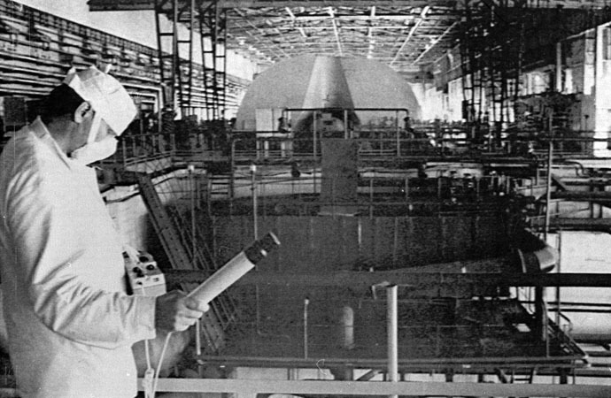 A worker at the Chernobyl nuclear power plant checks the radiation level in the engine room of the first and second power units in this June 5, 1986 file photo. (Reuters)