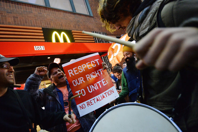 Demonstratorsoutside a McDonald's restaurant near New York's Times Square as part of a nationwide protest of fast food workers December 5, 2013. (AFP Photo / Stan Honda)