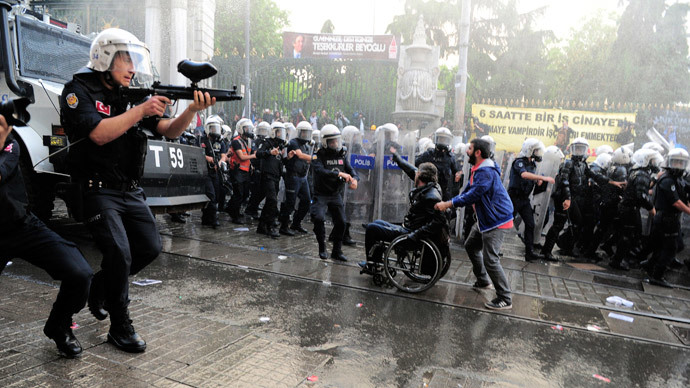 Riot police fire plastic paintball gun pellets to disperse protesters during a demonstration blaming the ruling AK Party (AKP) government for the mining disaster in western Turkey, in central Istanbul May 14, 2014.(Reuters / Yagiz Karahan)