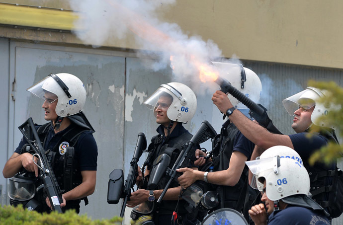 Riot police fire tear gas against protesters as they demonstrate to blame the ruling AK Party (AKP) government on the mining disaster in western Turkey, in Ankara May 14, 2014. (Reuters)