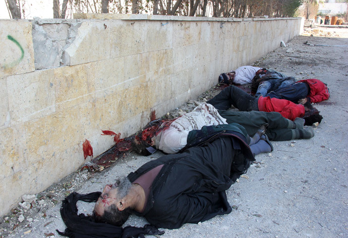 Bodies of handcuffed and blindfolded dead men lie on the ground of the Aleppo headquarters of the Islamic State of Iraq and the Levant (ISIL) after they were allegedly executed by the al-Qaeda-linked group, in the northern city of Aleppo (AFP Photo / Zakariya Al-Kafi)