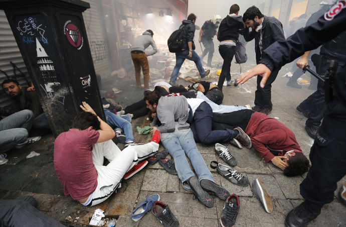 Anti-government protesters lie on the ground after riot police fired teargas to disperse them in central Istanbul May 31, 2014. (Reuters/Murad Sezer)