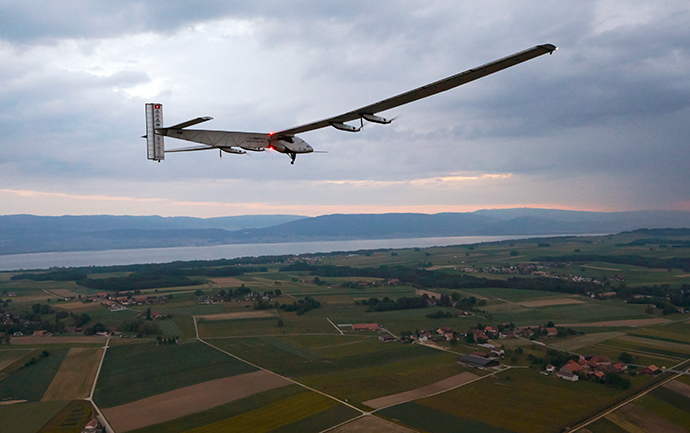 German test pilot Markus Scherdel steers the solar-powered Solar Impulse 2 aircraft for its maiden flight at its base in Payerne on June 2, 2014 (AFP Photo / Denis Balibouse)