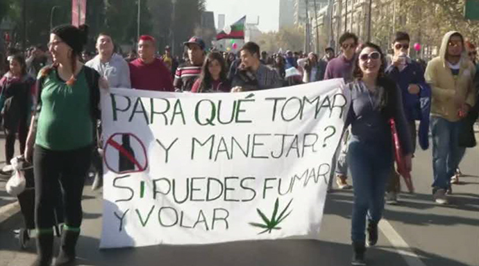 âWhy drink and drive, if you can smoke and flyâ banner. Still from AP video.