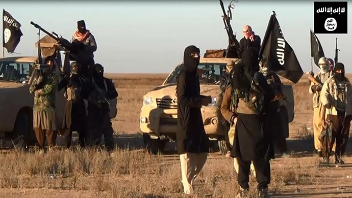 An image grab taken from a propaganda video uploaded on June 11, 2014 by jihadist group the Islamic State of Iraq and the Levant (ISIL) allegedly shows ISIL militants gathering at an undisclosed location in Iraq's Nineveh province. (AFP Photo / HO / ISIL)