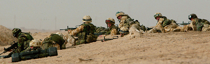 A reconnaissance party from 29 Commando Regiment Royal Artillery land on the al-Faw Peninsular in southern Iraq to establish the gun position ahead of 105mm guns arriving, March 21, 2003. (Reuters / Stephen Hird)