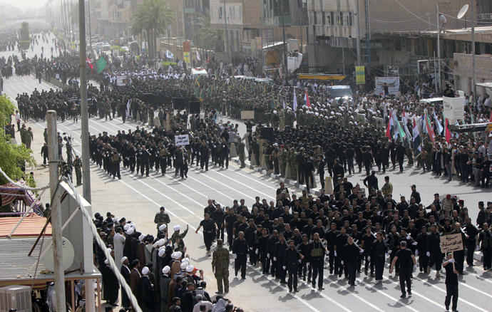Mehdi Army fighters loyal to Shi'ite cleric Moqtada al-Sadr march during a parade in Najaf, June 21, 2014. (Reuters/Alaa Al-Marjani)