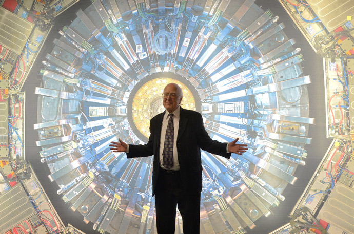 British scientist Peter Higgs poses in front of a photographic image of the Atlas detector at the Science Museum in London (Reuters / Toby Melville)