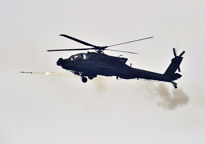 A US AH-64 Apache helicopter fires rockets (AFP Photo / Jung Yeon-Je)