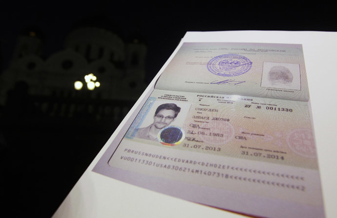 Fugitive former U.S. spy agency contractor Edward Snowden's new refugee documents granted by Russia is seen during a news conference in Moscow August 1, 2013. (Reuters)