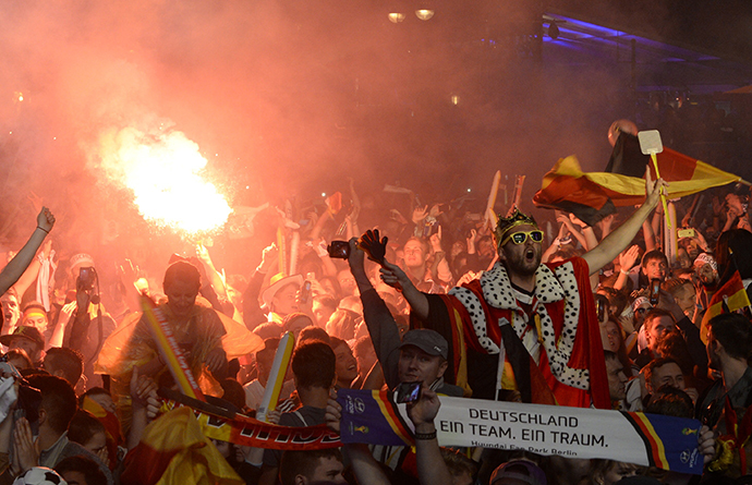 Fans of Germany celebrate as they watch the 2014 World Cup final between Germany and Argentina in Brazil at a public screening of the match in Berlin July 13, 2014. (Reuters / Fabian Bimmer)