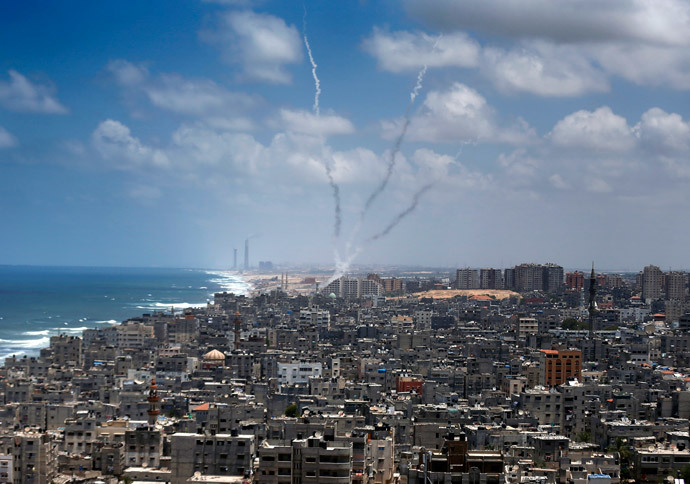 Smoke from rockets fired from Gaza City are seen after being launched toward Israel, on July 15, 2014. (AFP Photo / Thomas Coex)