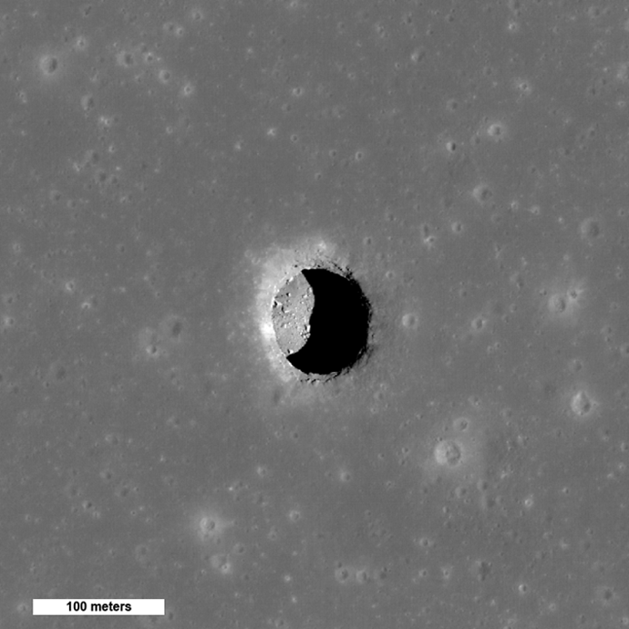 This is a spectacular high-Sun view of the Mare Tranquillitatis pit crater revealing boulders on an otherwise smooth floor. This image from LRO's NAC is 400 meters (1,312 feet) wide, north is up. (Image Credit: NASA/GSFC/Arizona State University)